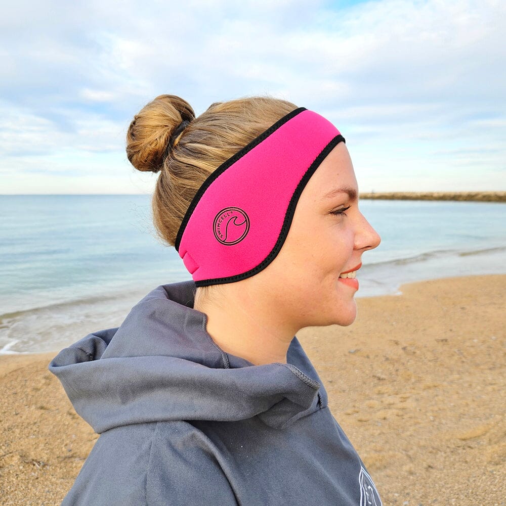 SwimCell Ear Warmer Headband on the beach pink