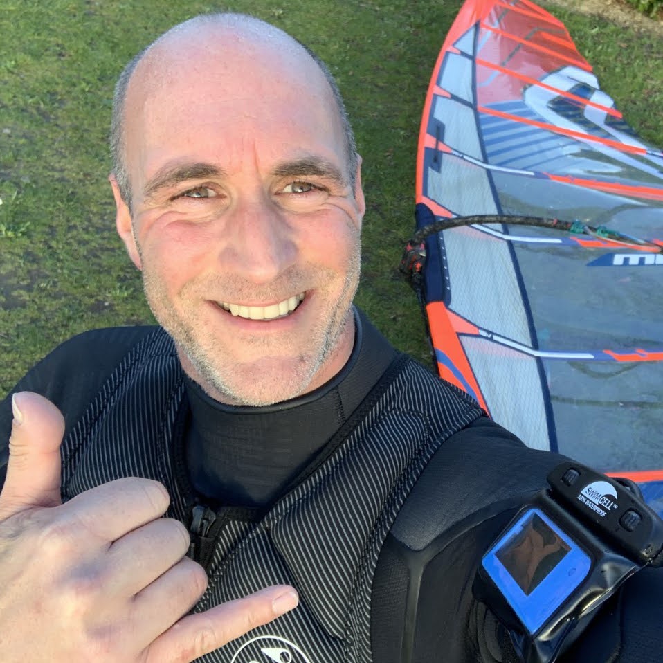 surfer smiling with waterproof key holder